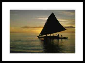 Silhouetted outrigger canoe on the Koro Sea